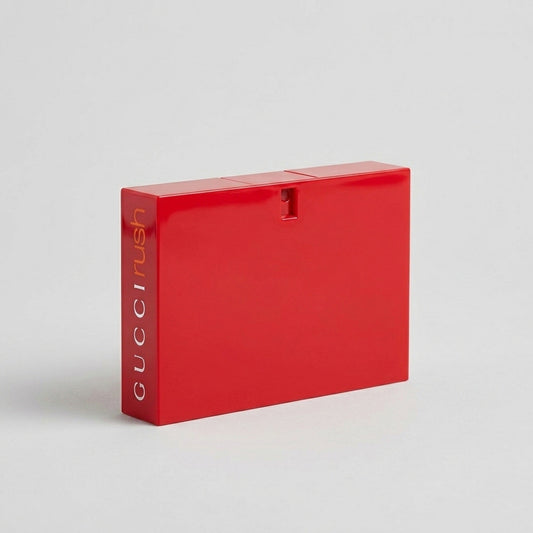 Gucci Rush eau de toilette 75 ml, frasco rojo, sobre fondo gris