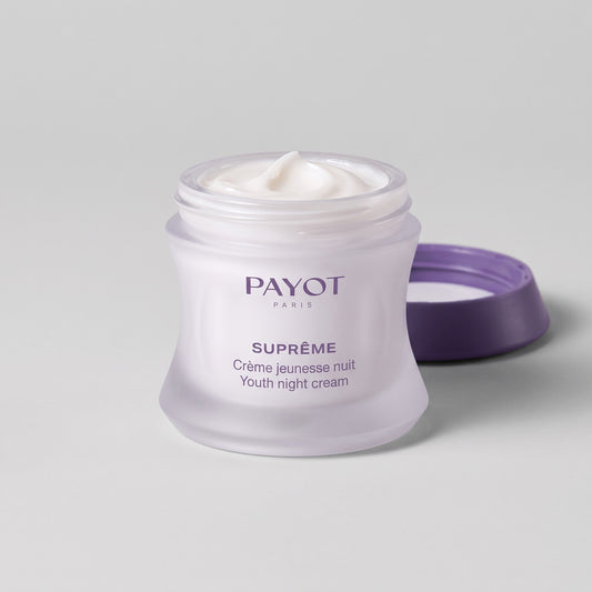 Tarro abierto de Payot Suprême Crème Jeunesse Nuit con la crema