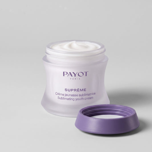 Tarro abierto de Payot Suprême Crème Jeunesse Sublimatrice con la crema