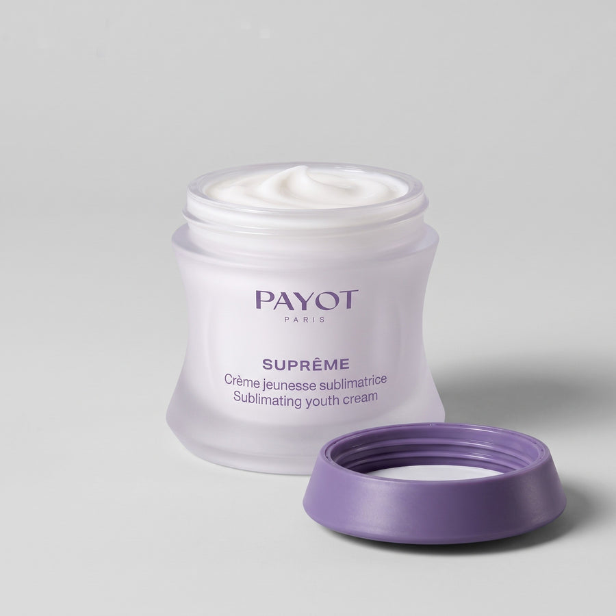 Tarro abierto de Payot Suprême Crème Jeunesse Sublimatrice con la crema