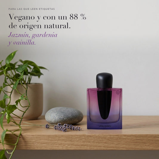 Shiseido Ginza Night en un estante con una planta, una piedra y madera